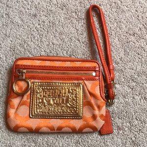 Orange coach poppy wristlet
